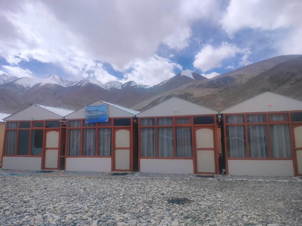 Cottage facade with clouds