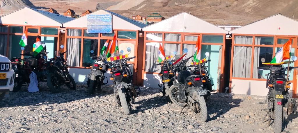 Bikers with Indian flags at cottage