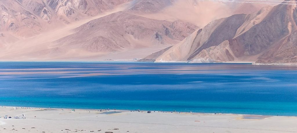 Pangong blue water with sandy beach