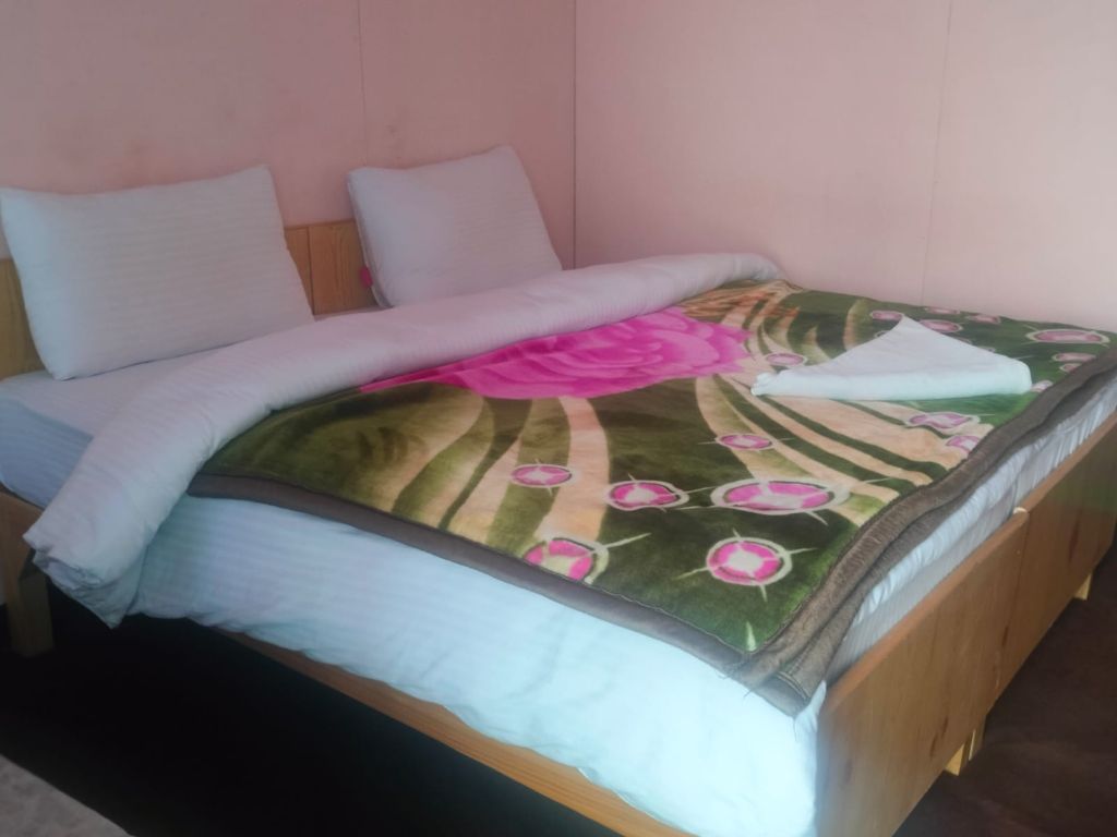 Room with floral blanket