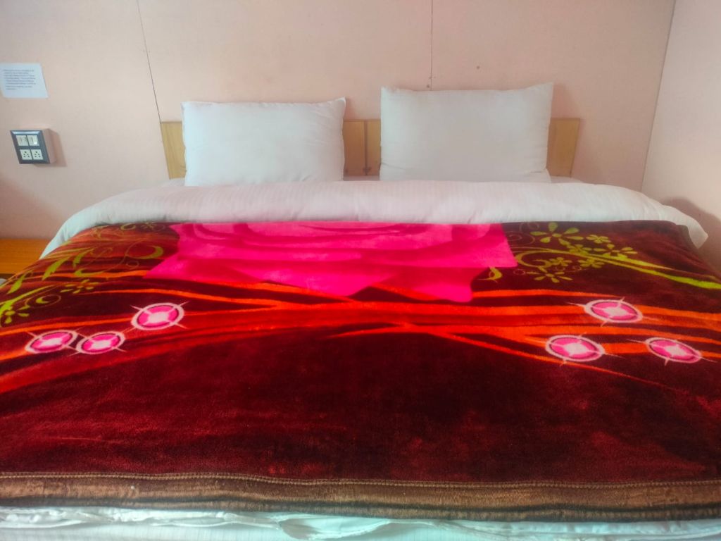 Deluxe room with colorful blanket