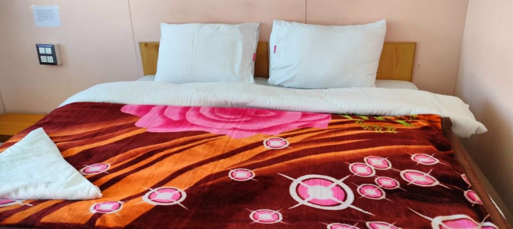 Double room with floral bedcover