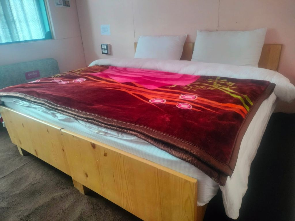 Room with wooden bed